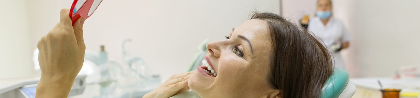 Smiling woman in dental chair at Frisco dental office