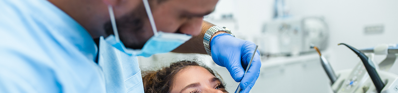 Dentist performing checkup and cleaning