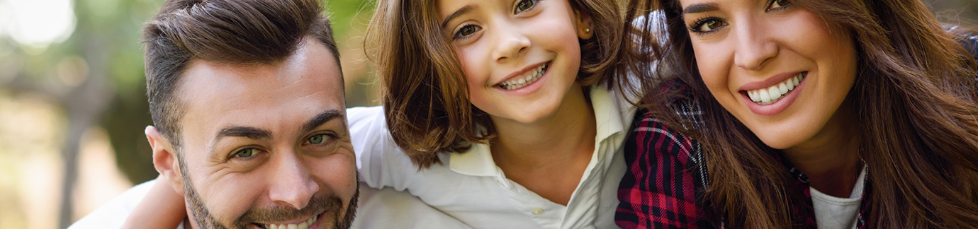 Parents and child smiling