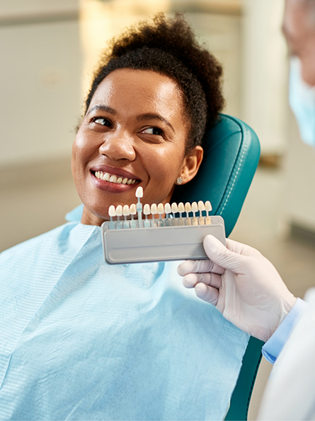 Patient having teeth shade matched for veneers
