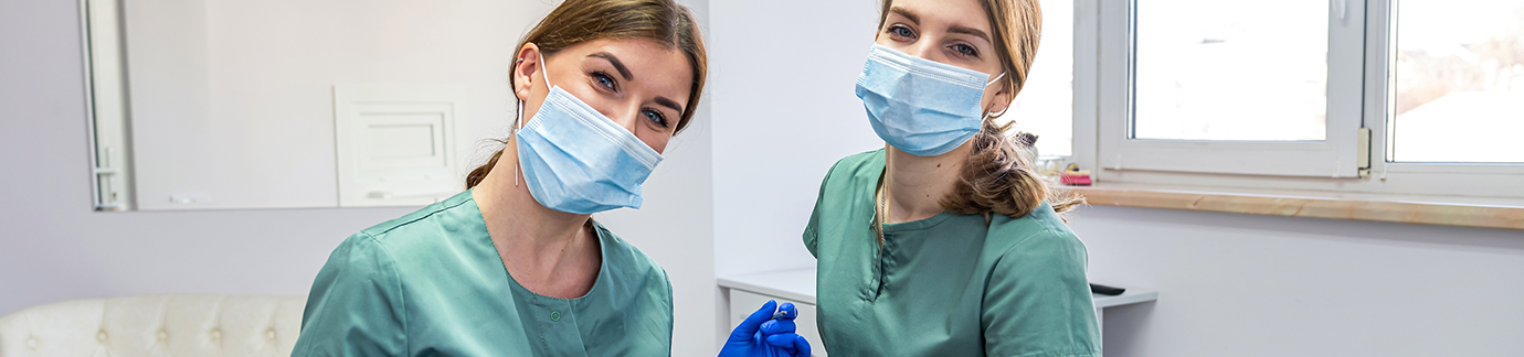 Two dentists with masks
